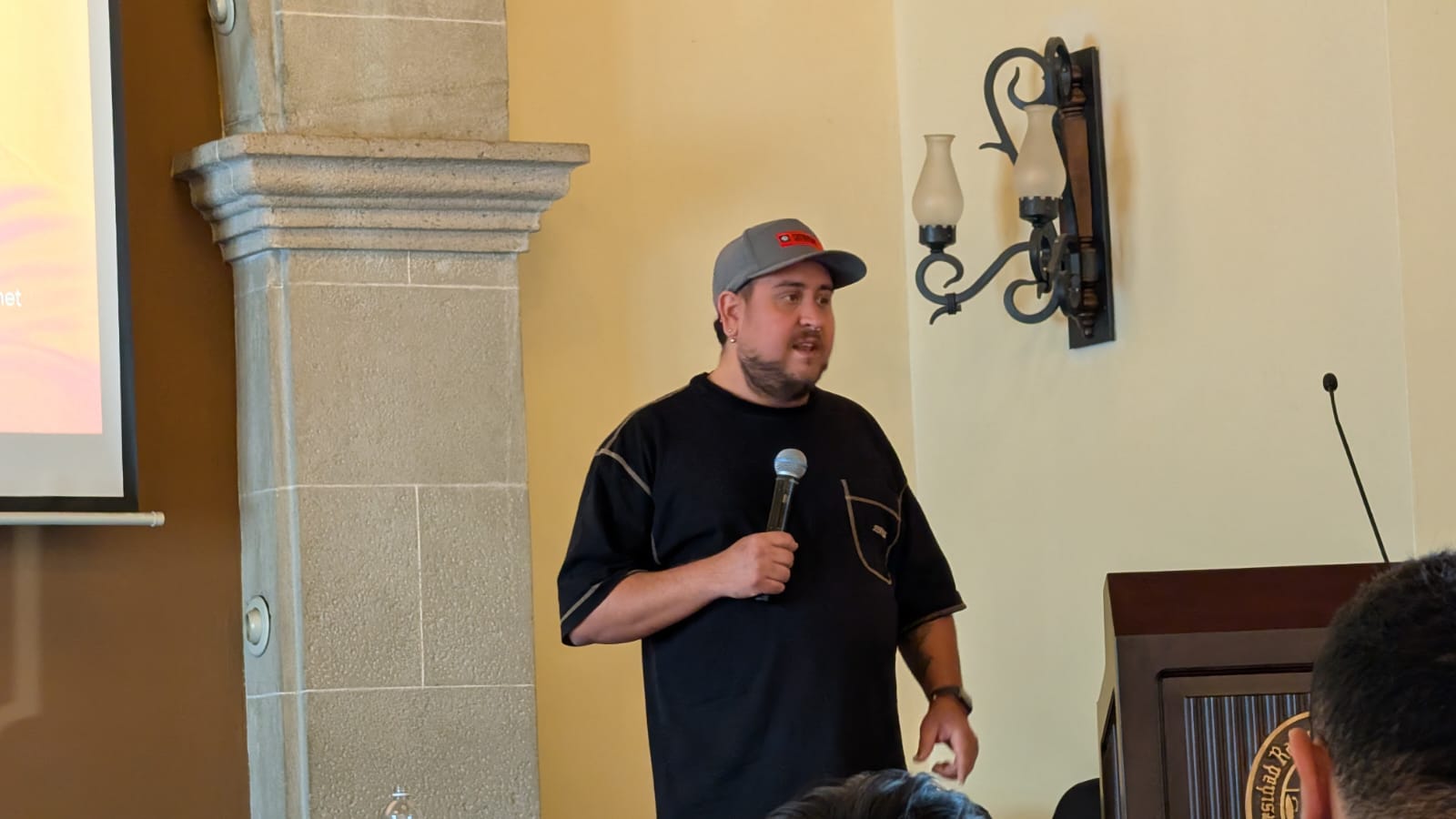 Ro Pinochet speaking to an audience